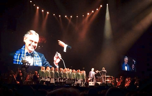 Andrea Bocelli with choir on stage at Glasgow Hydro wearing Italian National Tartan scarf and Bow Tie in November 2013